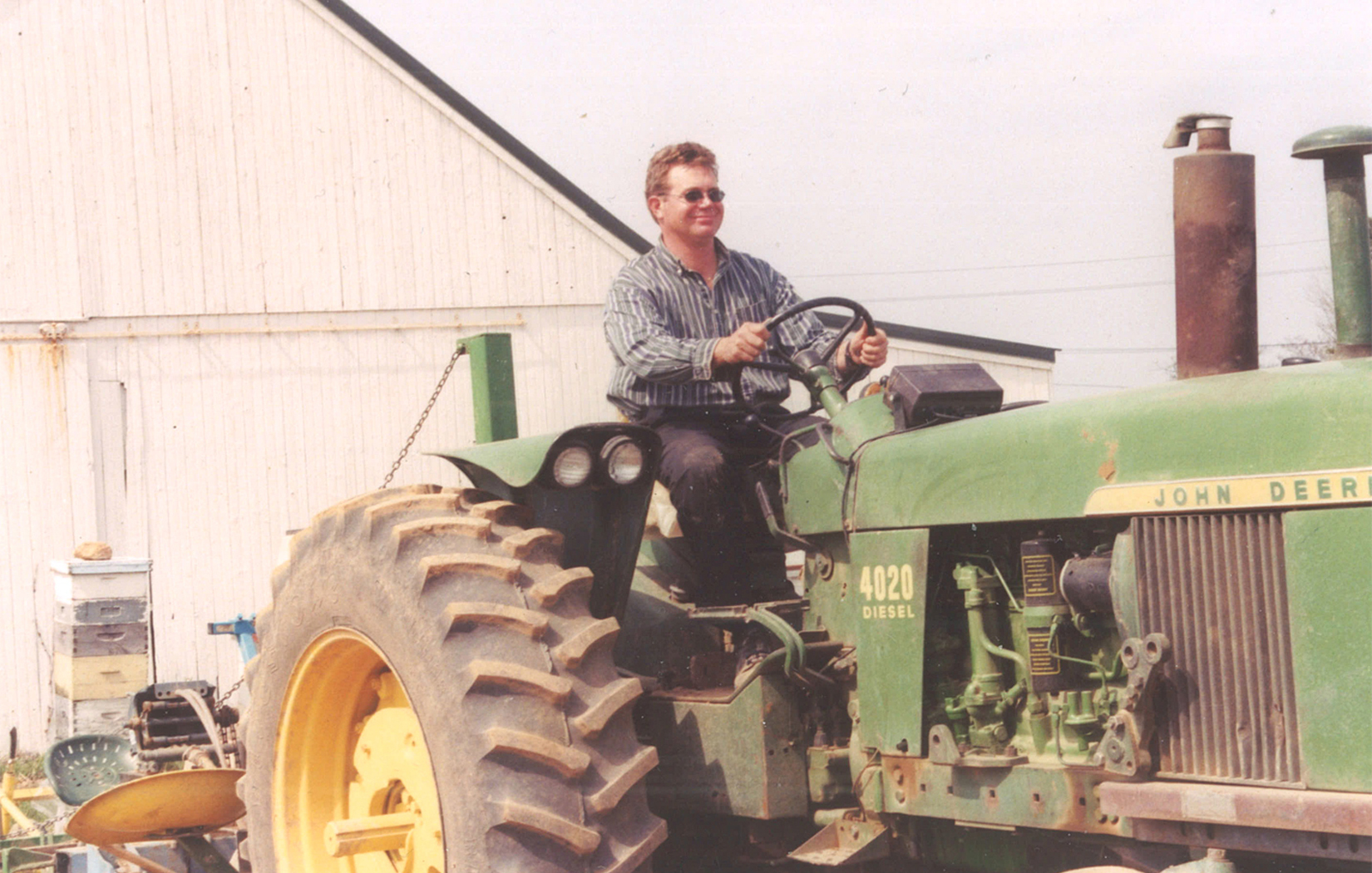 Edward Harbes Senior on a John Deere Tractor